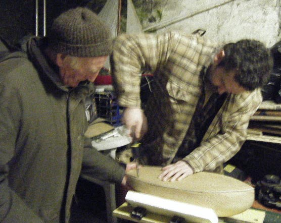 Loughie helps Stephen with the screwing down of the deck. Photo: MG